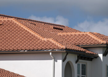 Close-up of ceramic tiled roofs on a sunny day, showcasing a traditional UK roofing style