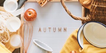 A neatly organised loft storage area with labelled boxes, folded clothes, and seasonal items arranged, representing the Autumn Declutter Challenge.
