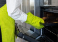 Oven cleaning in a UK kitchen showing a clean, grease-free oven interior with shining racks and a clear glass door after professional cleaning.