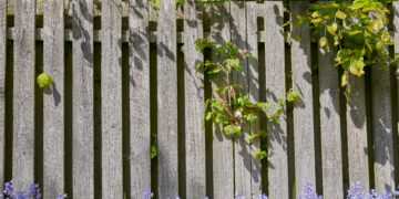 Metal garden fence panels installed along a residential boundary in a UK garden
