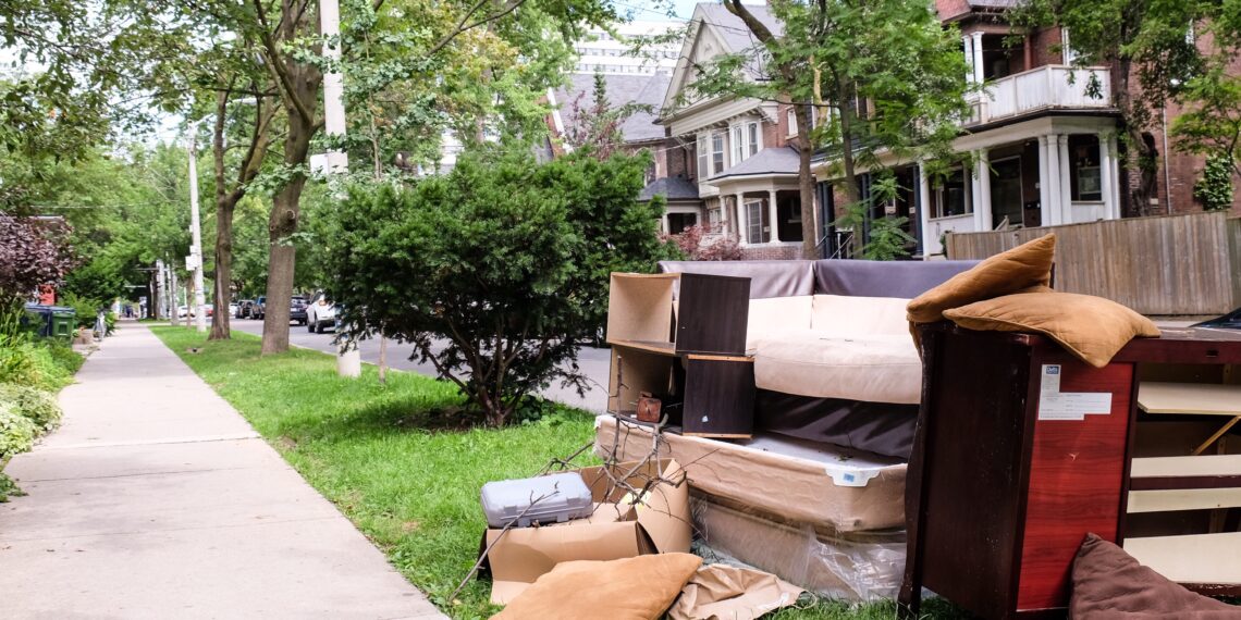 Old furniture left on the pavement for collection outside residential homes