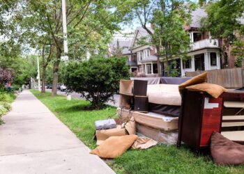 Old furniture left on the pavement for collection outside residential homes