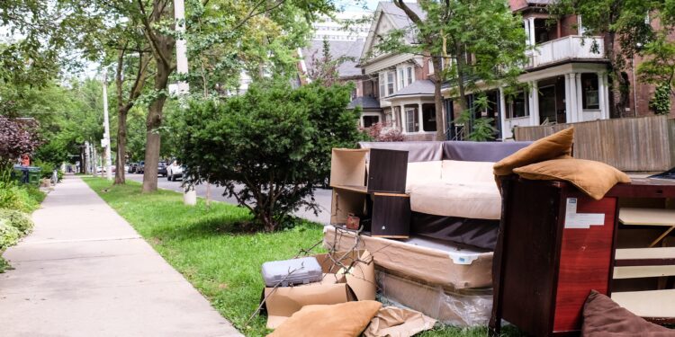 Old furniture left on the pavement for collection outside residential homes