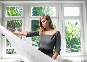 Newly installed white uPVC double-glazed windows on a residential UK home exterior
