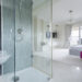 Contemporary wet room style bathroom with modern tiling, sleek fixtures, and homeowners comparing bathroom renovation and design options.