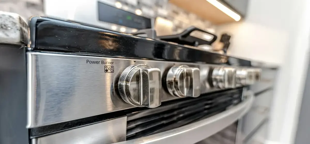Close-up of a cooker hob and oven in a kitchen