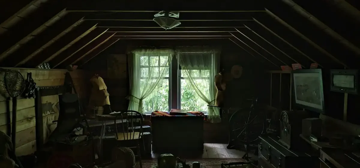 Attic floor covered with stored clutter and old household items