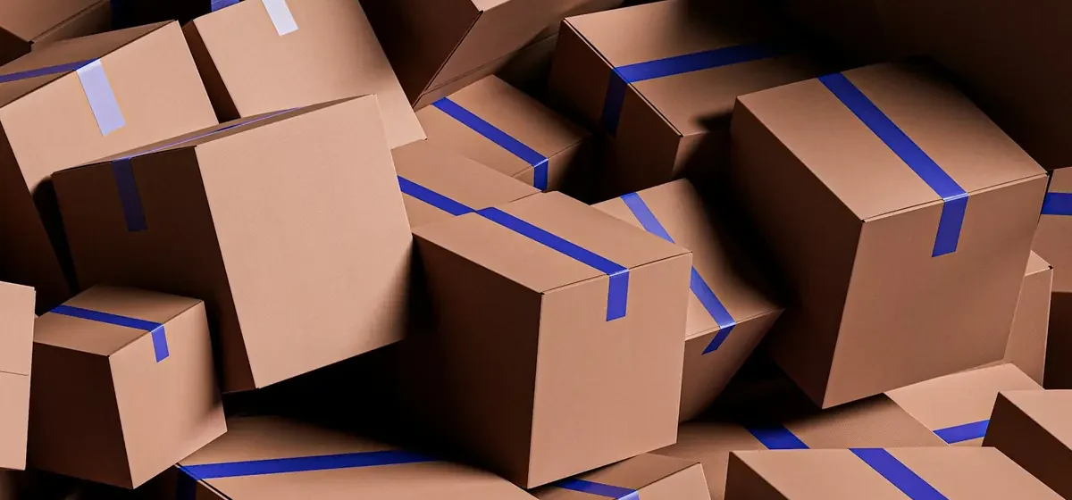 Large stack of taped brown cardboard packing boxes